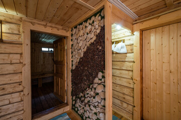 wooden bath, sauna interior. Dressing room, steam room, simple rustic decor