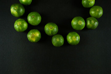 Green sweet tangerines growing with background