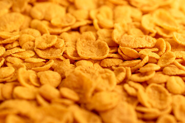Close up of golden colored corn flakes. 