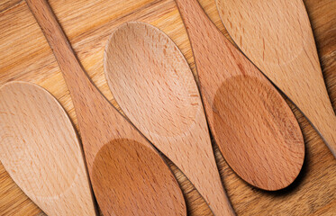 Repeating Wooden Spoons on Wood Background
