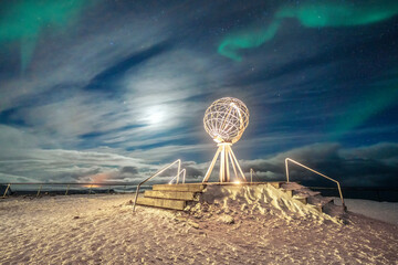The Northern Lights (Aurora Borealis) over the Globe Monument, symbol of North Cape (Nordkapp), Mageroya island, Troms og Finnmark