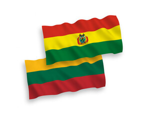Obraz premium National vector fabric wave flags of Lithuania and Bolivia isolated on white background. 1 to 2 proportion.