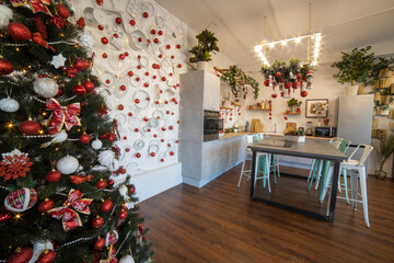 interior of a cozy modern spacious kitchen for a large family, decorated for the New Year celebration