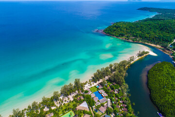 Fototapeta na wymiar Sea beach with resort resident and coconut palm tree aerial view