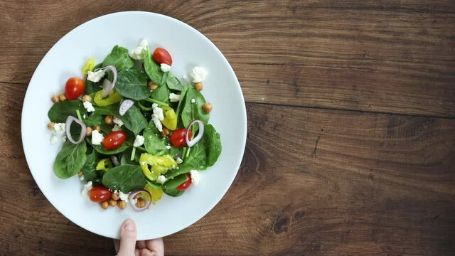 Serving a Healthy Spinach Salad with Roasted Chickpeas