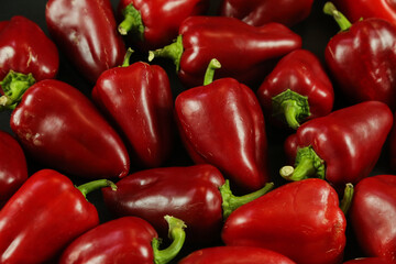 Obraz na płótnie Canvas Red peppers on black background