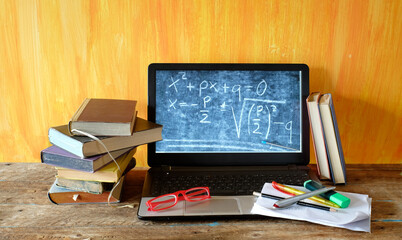 Home office,e-learning,home schooling concept with books, computer and office supplies