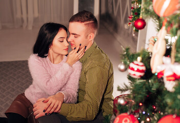 couple in love together in a cozy winter interior