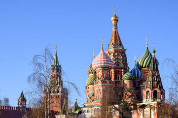 Fototapeta premium View of the Kremlin's Spasskaya Tower and St. Basil's Cathedral, Moscow, Russian Federation, December 05, 2020