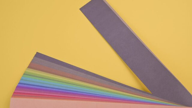 Different colors of the palette and the main color of 2021. Trendy Panton on a yellow background. Stopmotion. High quality FullHD footage