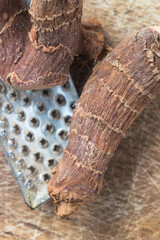 dried Alpinia galanga on a wooden table