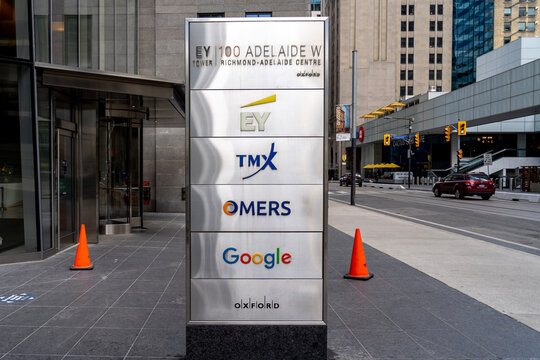 Toronto, Canada - November 14, 2020: A ground sign outside the entrance to EY, TMX, Omers and Google office at EY Tower in downtown Toronto.