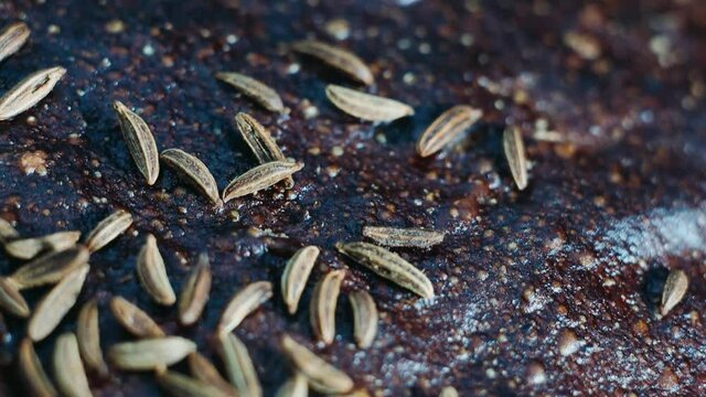 bread with caraway seeds close-up, macro video filming.