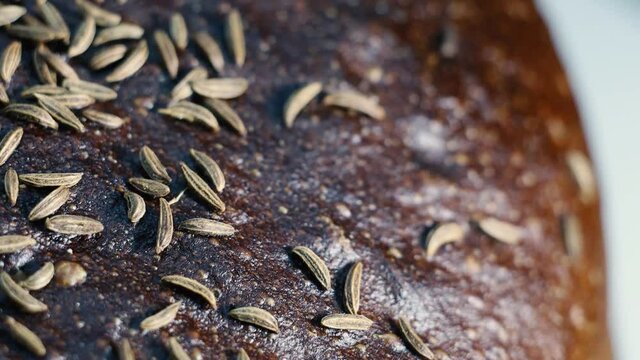 bread with caraway seeds close-up, macro video filming.