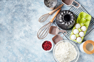 Baking ingredients and utensils, flour, eggs, baking dish.