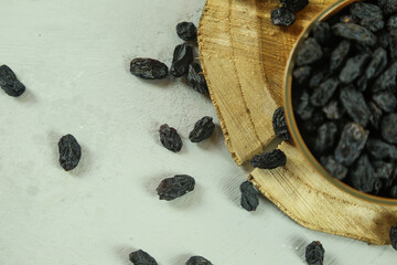 Dried raisins on white background