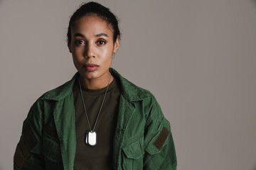 Confident african american soldier woman posing and looking at camera