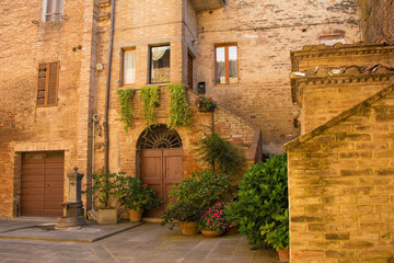 Fototapeta na wymiar Residential buildings in the historic medieval village of Buonconvento, Siena Province, Tuscany, Italy 