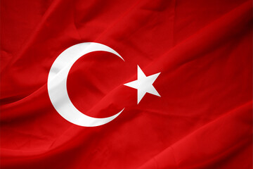 Close up shot of wavy, shiny Turkish flag