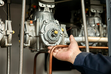 Workers examine parts inside the tanker with their bare hands