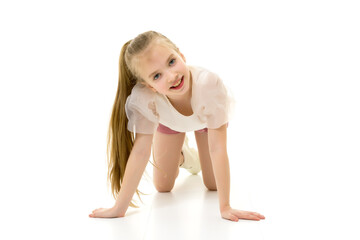 The little girl is on her knees.