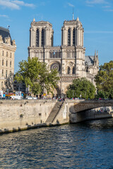 Fototapeta na wymiar Notre Dame Basilica seen from a boat on the Seine