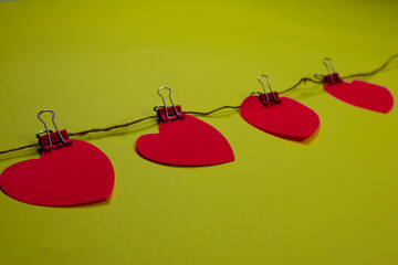 Pink hearts on a yellow background. Valentine's day concept