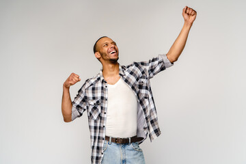 Naklejka premium Young African-American man yes win gesturing over light grey background