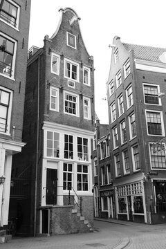 Street View with Old Houses in Amsterdam Red Light District in Black and White © Monica