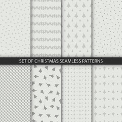 Set of minimalstic delicate christmas tree seamless patterns in white gray colors. Winter vector textures for wrapping and other design
