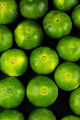 Green sweet tangerines growing with background