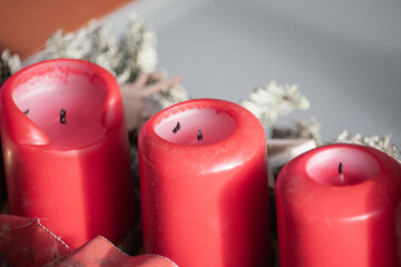 Selective focus shot of extinguished red candles