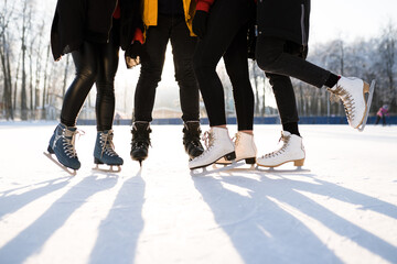 Obraz premium The concept of outdoor activities using skates on snowy ice. Outdoor vacations