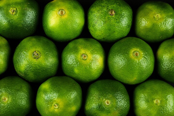 Green sweet tangerines growing with background