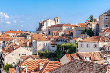 Fototapeta na wymiar Medieval church and red tiled roofs of the city of Dubrovnik, Croatia
