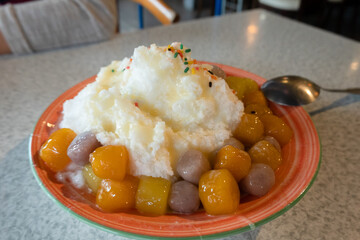 eating shaved ice with colorful dessert