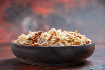 front view sliced cooked dough with rice on dark floor pasta dish dough meal