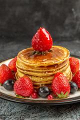 front view yummy pancakes with fruits and honey on light background breakfast sweet fruit