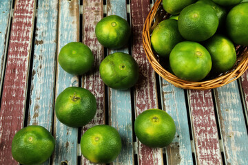 Green sweet tangerines growing with background