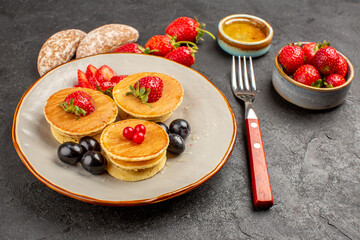 front view yummy pancakes with fruits on dark background fruit pie cake sweet