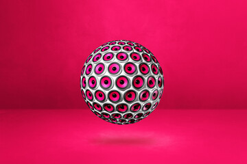 Speakers sphere on a pink studio background