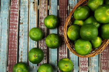 Green sweet tangerines growing with background