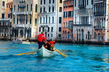 Rowing boat team training near Rialto Bridge in Venice, Italy