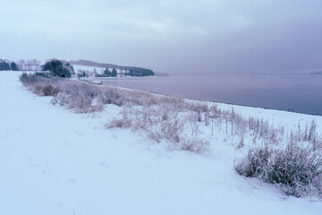 landscape with snow by the lake