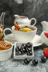 front view cup of tea with olives and honey on the dark background morning food breakfast