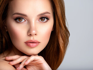 Portrait of beautiful young woman with bright brown makeup. Beautiful brunette with  brown lipstick on her lips.