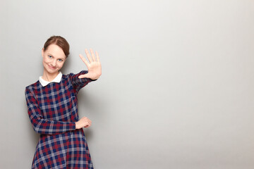 Portrait of happy girl showing number five with fingers