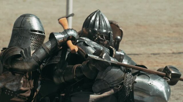 Close up tracking shot of fighting warrior with dangerous weapons. Striking and Hitting each other.