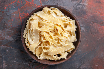 top view sliced raw dough inside plate on dark background dough pasta raw dark food
