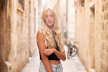 Young sexy tourist woman in the old town
